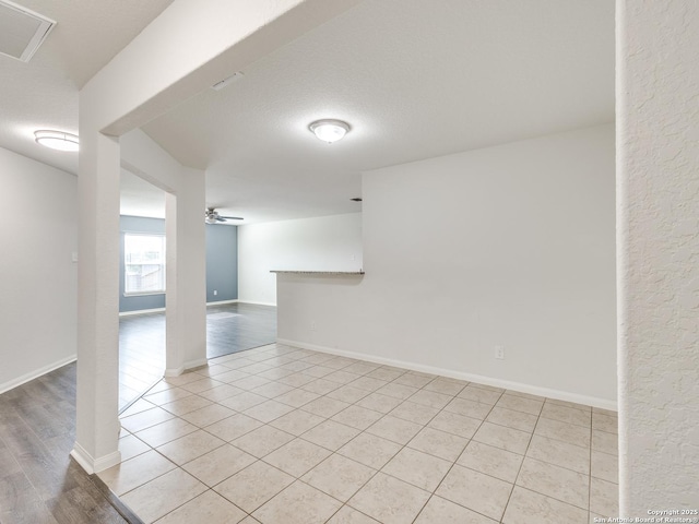 7071 Capeshaw, San Antonio, TX 78252 - unfurnished room featuring ceiling fan, light tile patterned floors, and baseboards