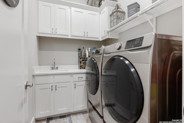 17918 Cantera Ct, San Antonio, TX 78255 - laundry room featuring washing machine and dryer and cabinet space