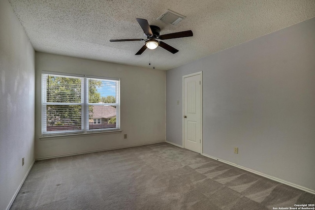 1632 Dogwood Ln, Schertz, TX 78154 - empty room featuring carpet, a textured ceiling, a ceiling fan, and baseboards