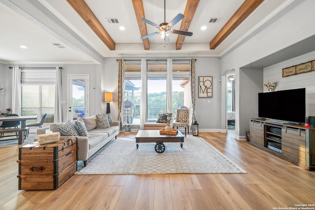 17055 Sonoma, San Antonio, TX 78255 - living area featuring a ceiling fan, beam ceiling, light wood-style flooring, arched walkways, and baseboards