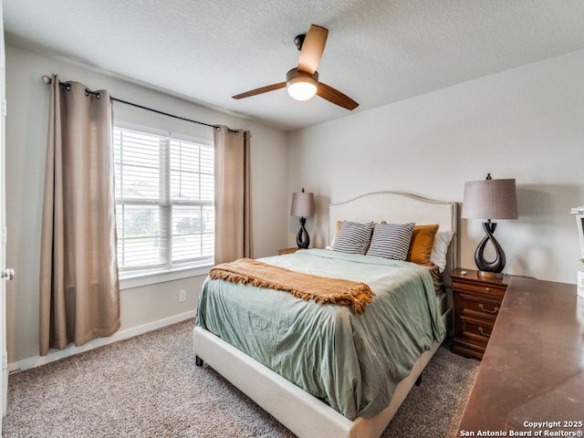 1136 Amber Lk, Seguin, TX 78155 - carpeted bedroom with baseboards, a textured ceiling, and ceiling fan