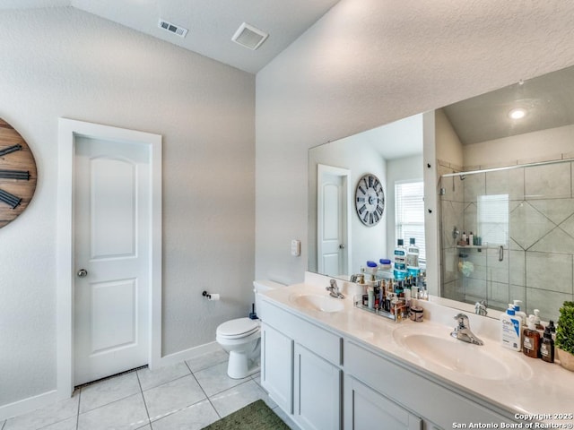1136 Amber Lk, Seguin, TX 78155 - full bathroom featuring baseboards, a stall shower, double vanity, toilet, and tile patterned flooring