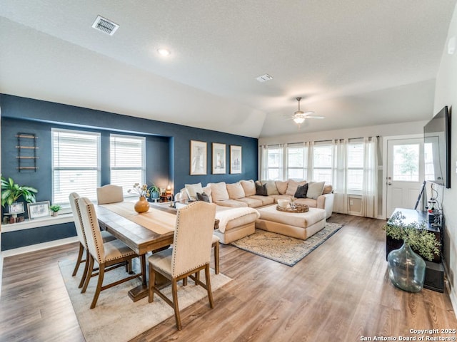 1136 Amber Lk, Seguin, TX 78155 - dining room with a ceiling fan, wood finished floors, vaulted ceiling, and baseboards