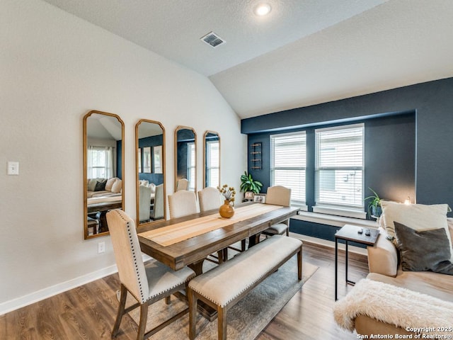 1136 Amber Lk, Seguin, TX 78155 - dining area with plenty of natural light, lofted ceiling, wood finished floors, and baseboards