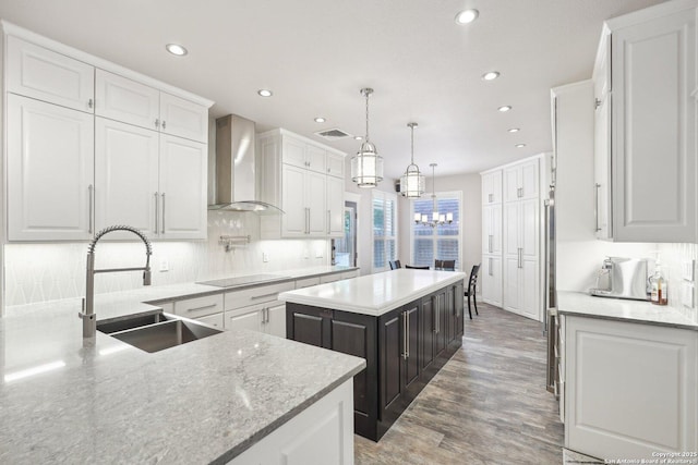 2834 Olive Ave, Schertz, TX 78154 - kitchen with wall chimney exhaust hood, a sink, black electric stovetop, white cabinets, and backsplash