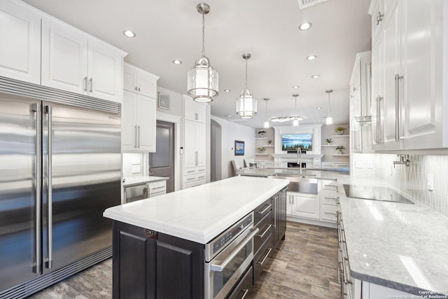 2834 Olive Ave, Schertz, TX 78154 - kitchen featuring stainless steel appliances, a sink, white cabinetry, tasteful backsplash, and recessed lighting