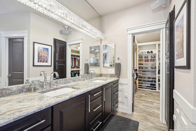 2834 Olive Ave, Schertz, TX 78154 - full bath with double vanity, a spacious closet, and wood finished floors