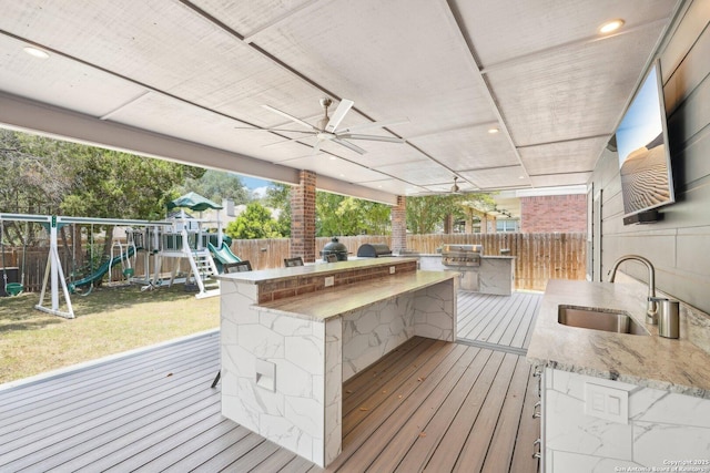 2834 Olive Ave, Schertz, TX 78154 - deck featuring a sink, a playground, and ceiling fan