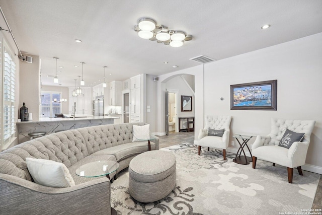 2834 Olive Ave, Schertz, TX 78154 - living area featuring arched walkways, baseboards, and recessed lighting