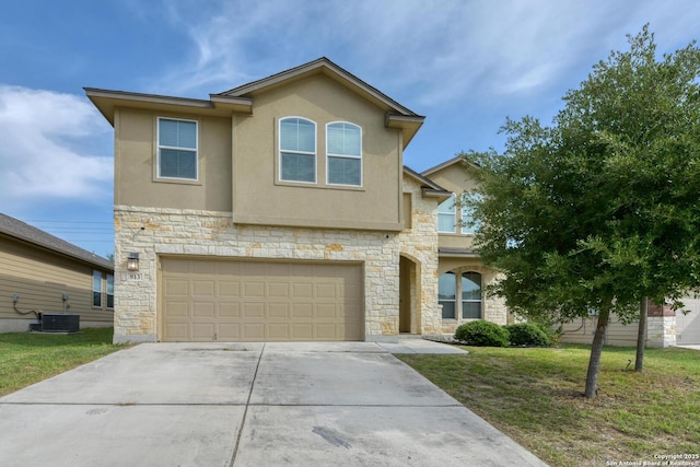 913 Pipe Gate, Cibolo, TX 78108 - view of front facade with stone siding, concrete driveway, an attached garage, stucco siding, and a front yard