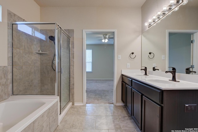 913 Pipe Gate, Cibolo, TX 78108 - bathroom featuring a shower stall, a bath, double vanity, ceiling fan, and tile patterned flooring