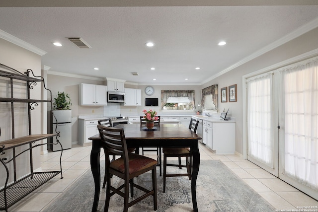 14211 Edge Pt, San Antonio, TX 78230 - dining space with light tile patterned floors, recessed lighting, ornamental molding, and baseboards