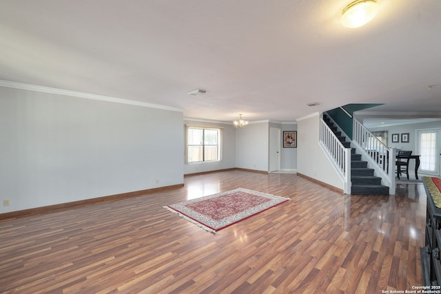 14211 Edge Pt, San Antonio, TX 78230 - unfurnished living room with wood finished floors, a chandelier, stairs, baseboards, and crown molding