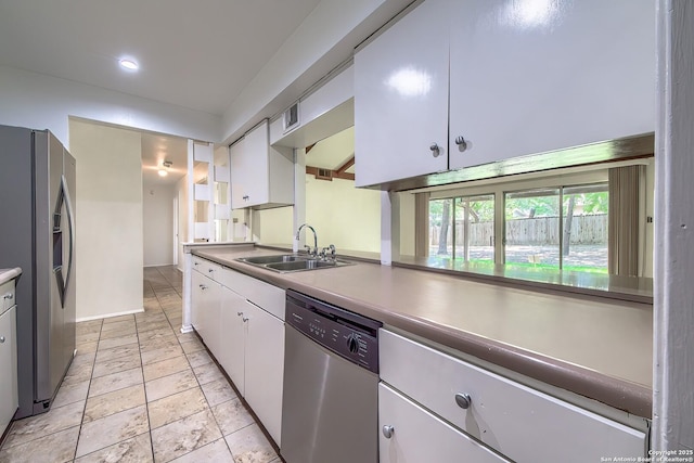 3206 Bluefield, San Antonio, TX 78230 - kitchen with appliances with stainless steel finishes, a sink, white cabinetry, recessed lighting, and baseboards