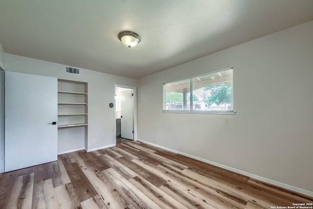 3206 Bluefield, San Antonio, TX 78230 - unfurnished bedroom with wood finished floors and baseboards