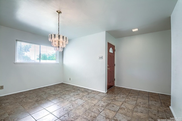 3206 Bluefield, San Antonio, TX 78230 - empty room with baseboards, a chandelier, and stone finish floors