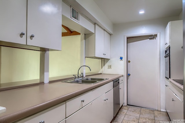 3206 Bluefield, San Antonio, TX 78230 - kitchen featuring a sink, white cabinets, stainless steel appliances, light countertops, and recessed lighting