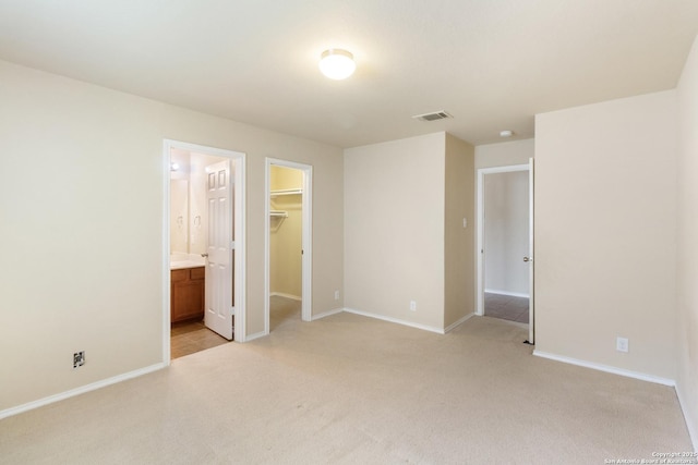 4519 Jeffs Farm, San Antonio, TX 78244 - unfurnished bedroom featuring light carpet, a spacious closet, a closet, and ensuite bathroom