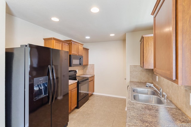 4519 Jeffs Farm, San Antonio, TX 78244 - kitchen with black appliances, backsplash, light countertops, recessed lighting, and brown cabinets