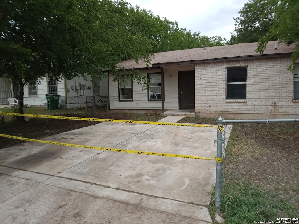 3435 Gateway Dr, San Antonio, TX 78210 - view of front of home with uncovered parking and a shingled roof