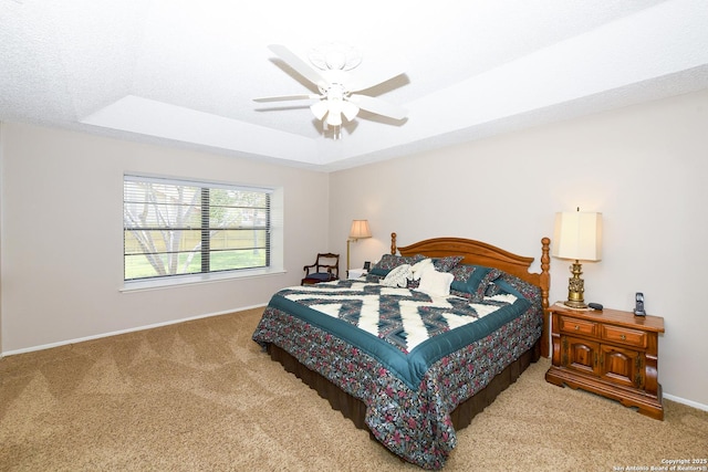 1415 Synandra, San Antonio, TX 78232 - carpeted bedroom with a tray ceiling, baseboards, and ceiling fan
