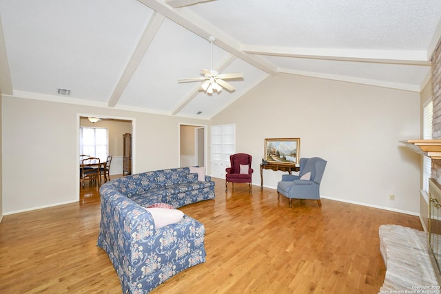 1415 Synandra, San Antonio, TX 78232 - living area featuring wood finished floors, a ceiling fan, a fireplace, and baseboards