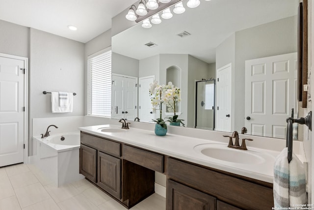 11227 Raw Sienna, Helotes, TX 78023 - bathroom with a stall shower, double vanity, a bath, and tile patterned floors