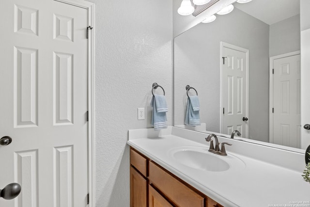 11227 Raw Sienna, Helotes, TX 78023 - bathroom featuring a textured wall and vanity
