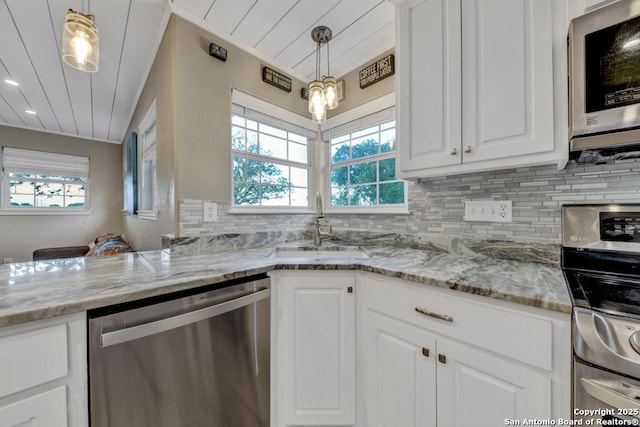 15592 Miller, Saint Hedwig, TX 78152 - kitchen featuring appliances with stainless steel finishes, healthy amount of natural light, white cabinetry, and wood ceiling