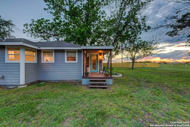 15592 Miller, Saint Hedwig, TX 78152 - back of property at dusk with a lawn