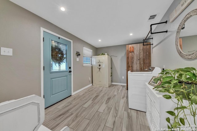 15592 Miller, Saint Hedwig, TX 78152 - laundry area with cabinet space, independent washer and dryer, recessed lighting, light wood-type flooring, and baseboards