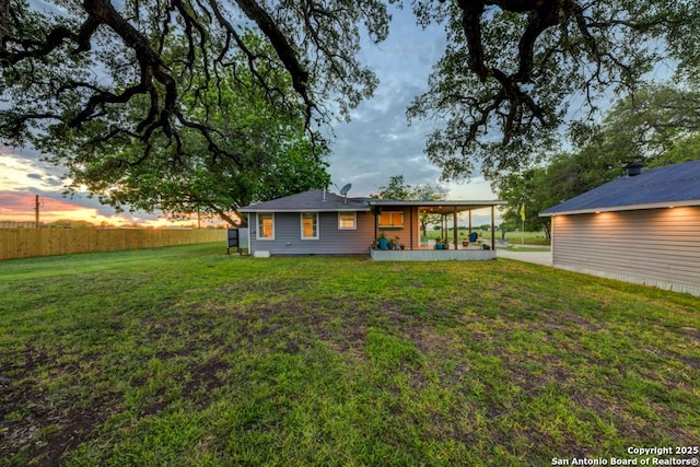15592 Miller, Saint Hedwig, TX 78152 - back of house at dusk featuring a lawn