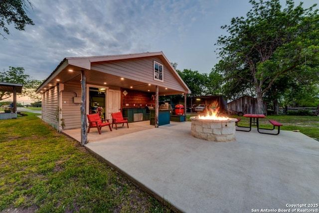 15592 Miller, Saint Hedwig, TX 78152 - view of patio / terrace with a fire pit and an outdoor structure