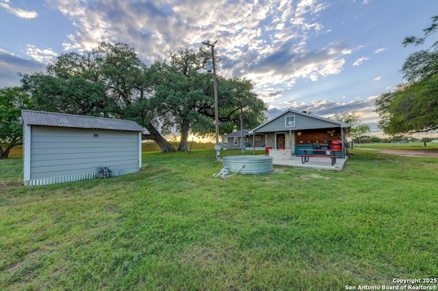 15592 Miller, Saint Hedwig, TX 78152 - view of green lawn with a jacuzzi, a patio area, and an outbuilding