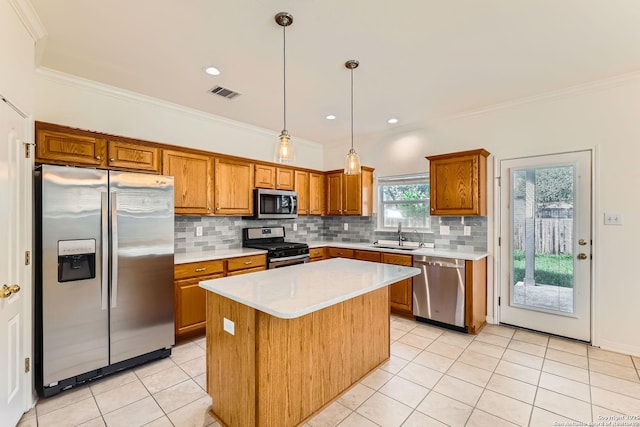 2510 Sage Holw, San Antonio, TX 78251 - kitchen featuring stainless steel appliances, brown cabinets, light tile patterned floors, light countertops, and ornamental molding