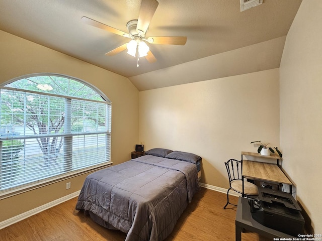 2115 Bentwood, New Braunfels, TX 78130 - bedroom with wood finished floors, baseboards, a ceiling fan, and lofted ceiling