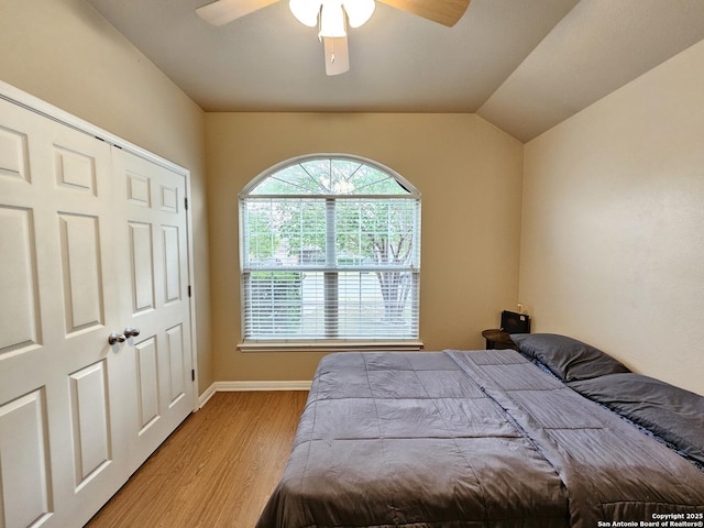 2115 Bentwood, New Braunfels, TX 78130 - bedroom with light wood-type flooring, a ceiling fan, baseboards, and lofted ceiling