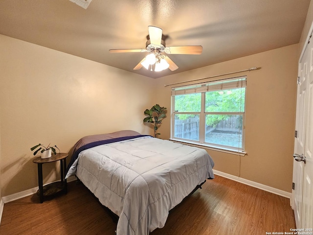 2115 Bentwood, New Braunfels, TX 78130 - bedroom with baseboards, wood finished floors, and ceiling fan