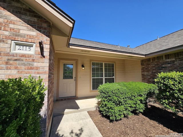 2115 Bentwood, New Braunfels, TX 78130 - entrance to property featuring brick siding and a shingled roof