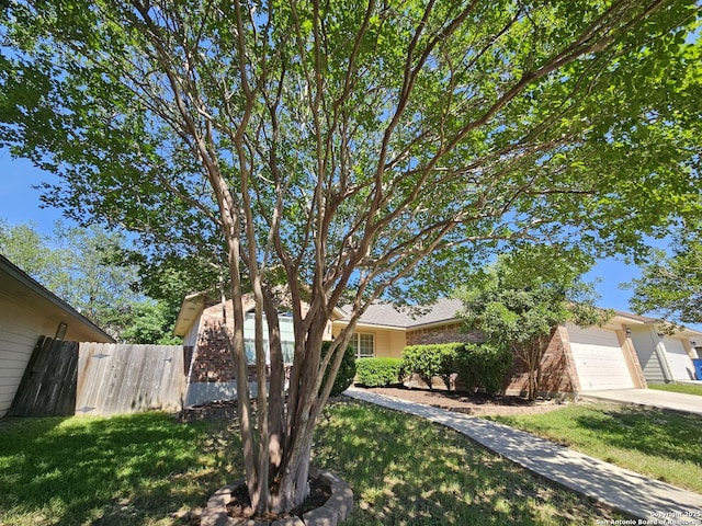 2115 Bentwood, New Braunfels, TX 78130 - view of front facade with an attached garage and concrete driveway
