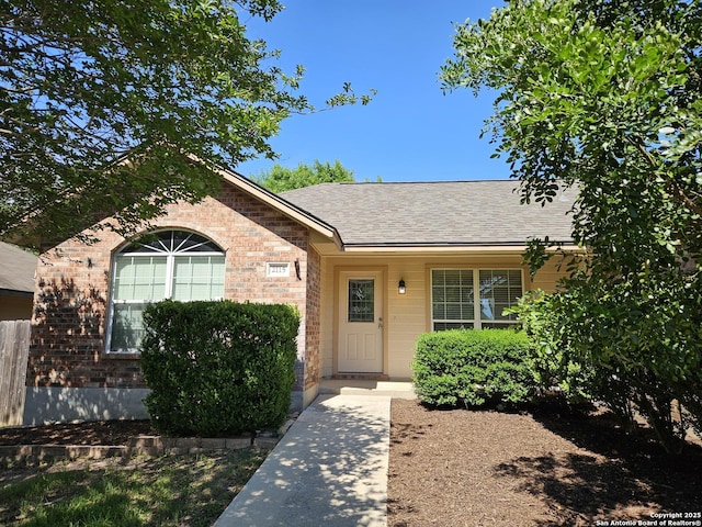 2115 Bentwood, New Braunfels, TX 78130 - view of front of house featuring brick siding and a shingled roof