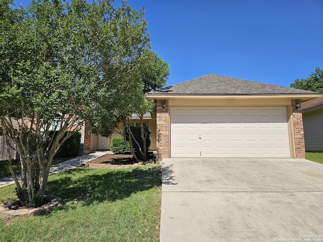 2115 Bentwood, New Braunfels, TX 78130 - view of front of home with brick siding, concrete driveway, and a garage