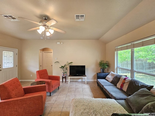 2115 Bentwood, New Braunfels, TX 78130 - living room with light tile patterned floors, arched walkways, plenty of natural light, and ceiling fan