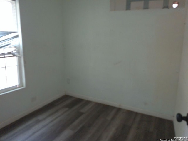 2619 E Houston St, San Antonio, TX 78202 - unfurnished room with baseboards and wood finished floors