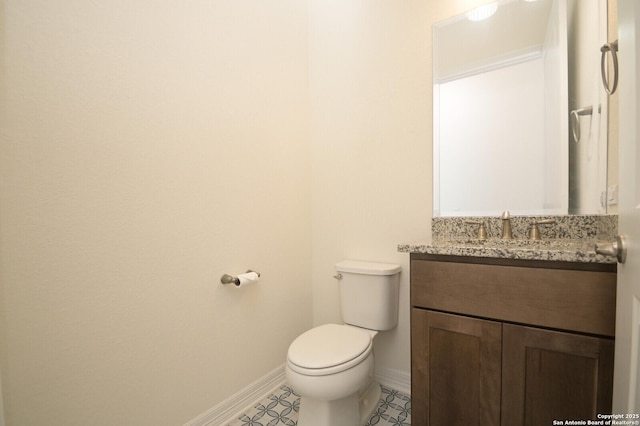 23402 Grande Vis, San Antonio, TX 78261 - half bathroom featuring vanity, toilet, and baseboards