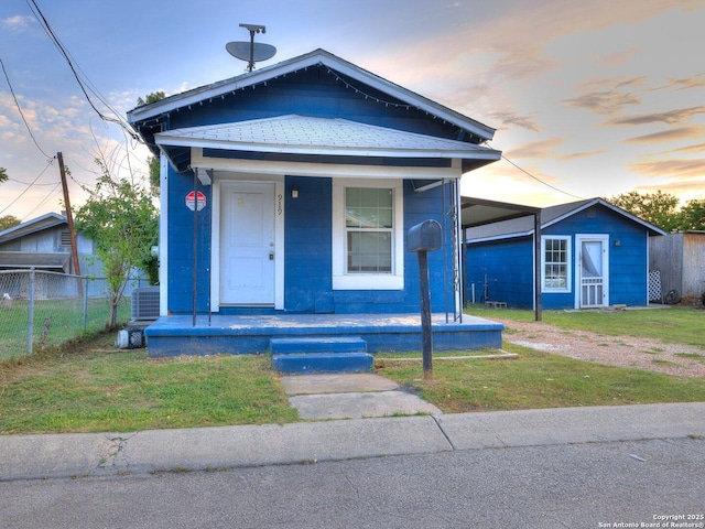 919 Monclova Aly, San Antonio, TX 78207 - shotgun-style home featuring a porch and an outdoor structure