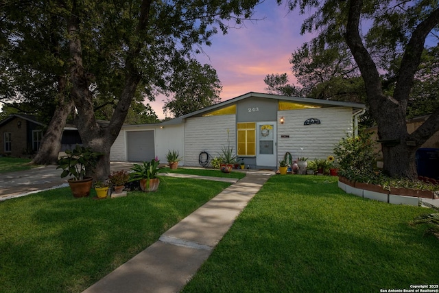 243 Future Dr, San Antonio, TX 78213 - mid-century home with a front lawn, a garage, and driveway