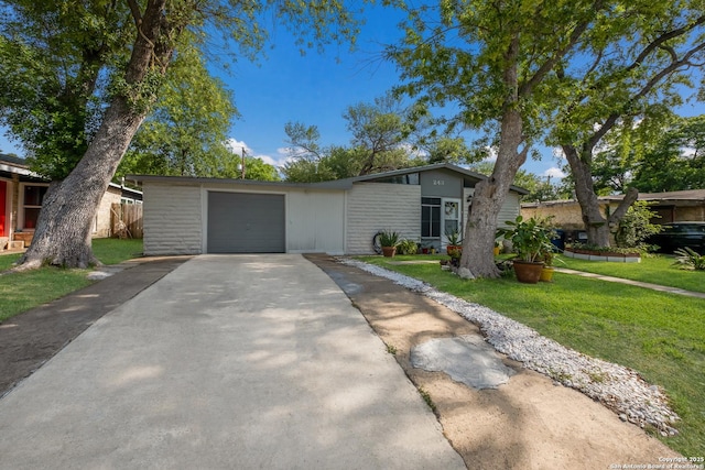 243 Future Dr, San Antonio, TX 78213 - mid-century home featuring asphalt driveway and an attached garage