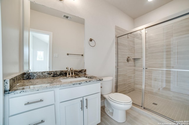 8119 Ventura Blvd, Selma, TX 78154 - bathroom with toilet, vanity, and a stall shower