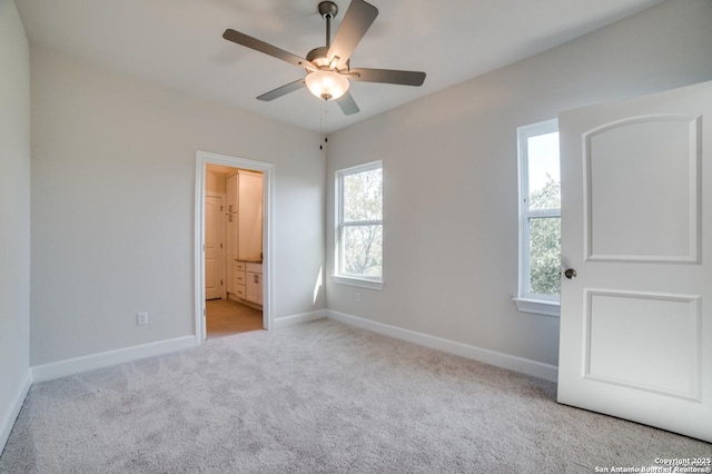 8119 Ventura Blvd, Selma, TX 78154 - unfurnished bedroom featuring carpet, baseboards, connected bathroom, and ceiling fan